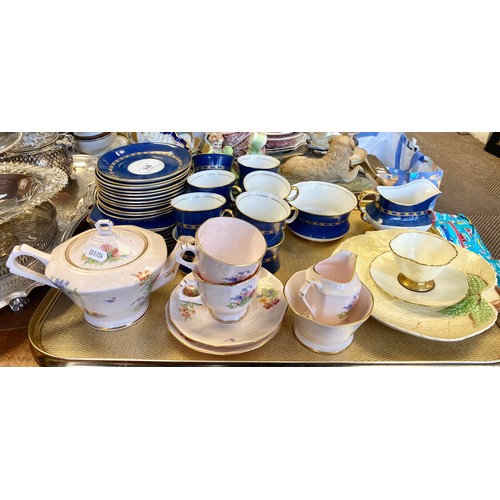 335 - Carlton ware blue and gilt teaware and a Plant Tuscan tea for two set.