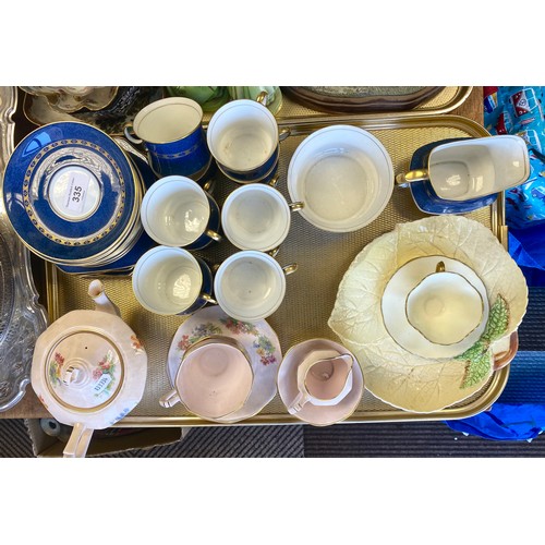 335 - Carlton ware blue and gilt teaware and a Plant Tuscan tea for two set.