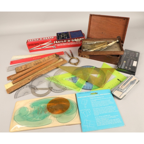 286 - Assorted stationery items to include compasses, rulers, magnifying glasses, protractors, etc