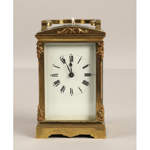 379 - Brass four glass carriage clock with domed top. 12cm excluding handle