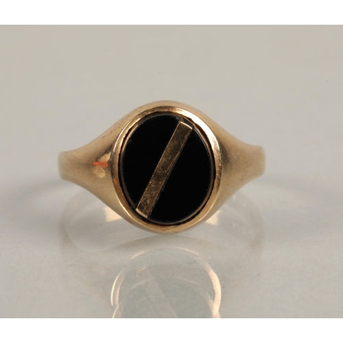 218 - 9ct gold signet ring set with black gem, ring size W, 3.5g