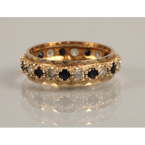 222 - 9ct gold eternity ring set with alternating blue and white CZ gems, 2.8g, ring size N