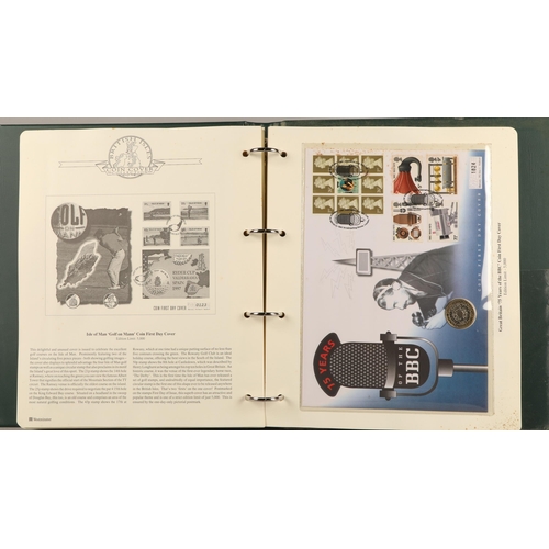 303 - Three albums containing various first-day covers and commemorative coins