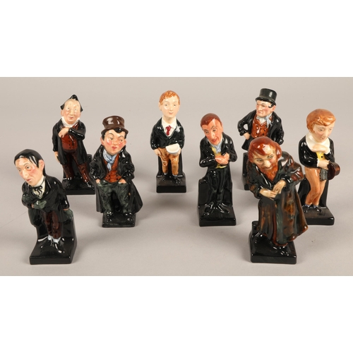 257 - Eight Royal Doulton Dickens character figures including Artful Dodger, Oliver Twist, etc