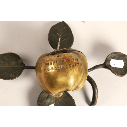 248 - Novelty brass apple hinged box on leafy branch base, 'Compliments of L.G. Hawkins & Co. LTD'