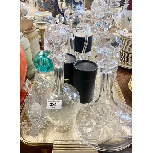 324 - Collection of glassware to include decanters, claret jug, condiments paperweight etc.