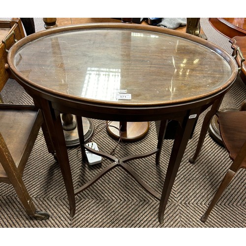 571 - Oval glass topped occasional table, 74cm high