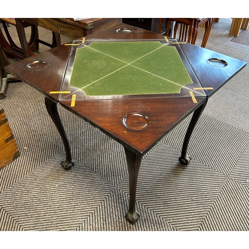 579 - Mahogany envelope games table with fitted drawer, raised on ball and claw feet, 76cm high