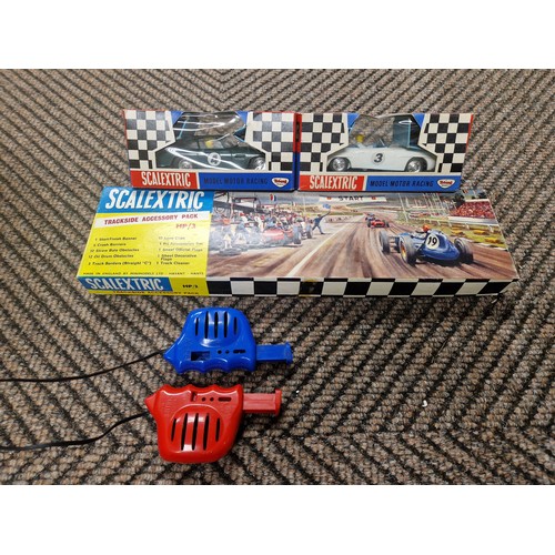 403 - Two Scaletrix motor racing cars, trackside accessory point, power unit