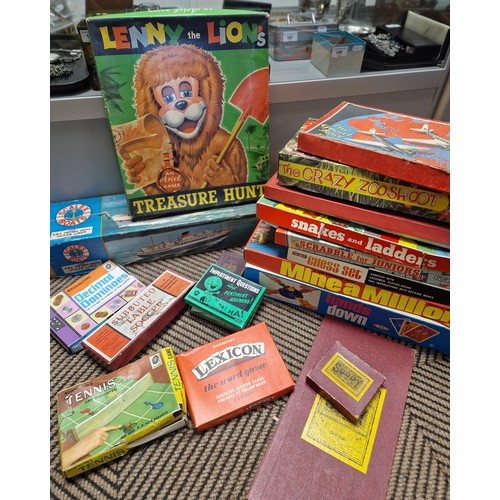 411 - Two boxes of vintage boardgames, Matchbox SF2 loop set, trik trak rally set, monopoly, scrabble, sor... 