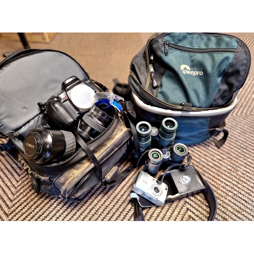 422 - Two rucksack camera bags containing Minolta camera, lenses, binoculars, etc