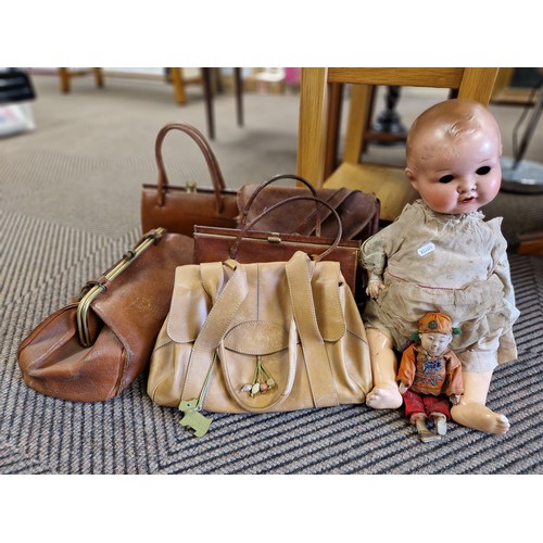 427 - Armand Marseille jointed doll, Chinese doll, Radley bag, and four vintage brown leather hand bags