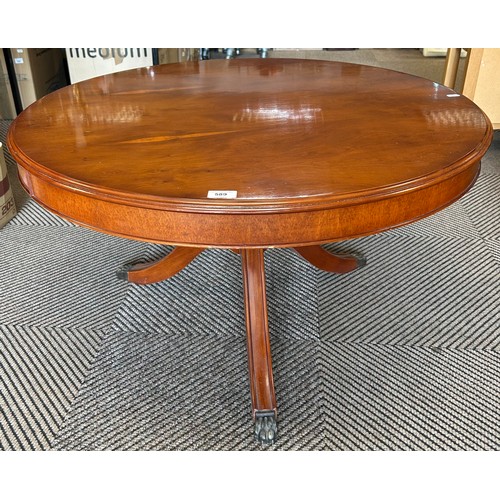 589 - Revolving yew wood circular coffee table with tripod legs, 53cm high