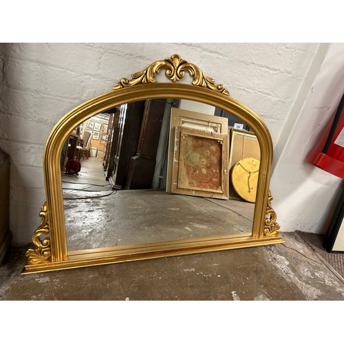 596 - Ornate gilt wall mirror, 81cm x 113cm