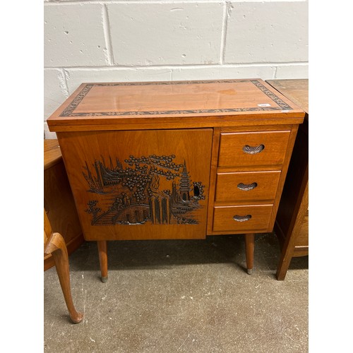 668 - Carved mid century side unit with folding top and Oriental-style carvings