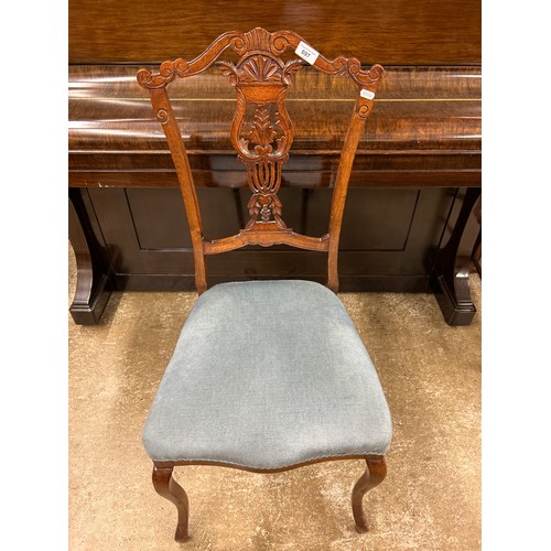 697 - Dining chair with ornate carved back