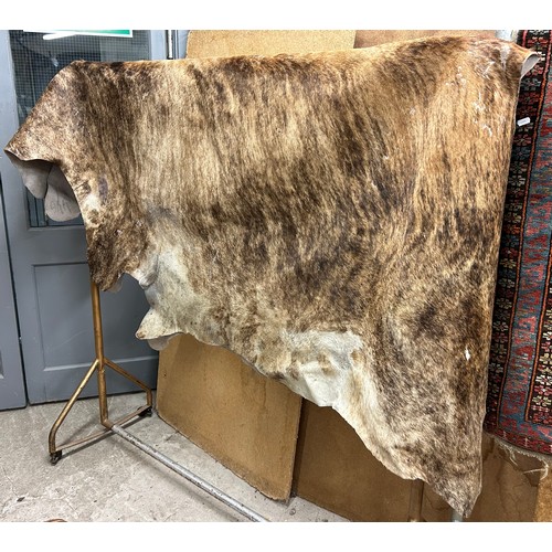 711 - Large cowhide rug