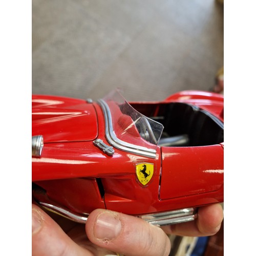 425 - Three Burago boxed model Ferrari cars and another (4)