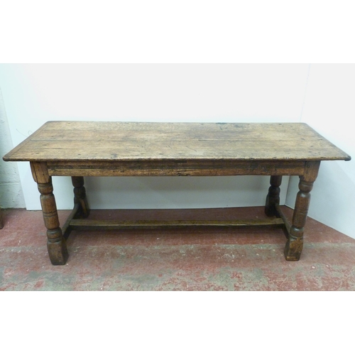 504 - Jacobean Revival jointed oak refectory table with fixed plank top above reeded frieze, on turned col... 