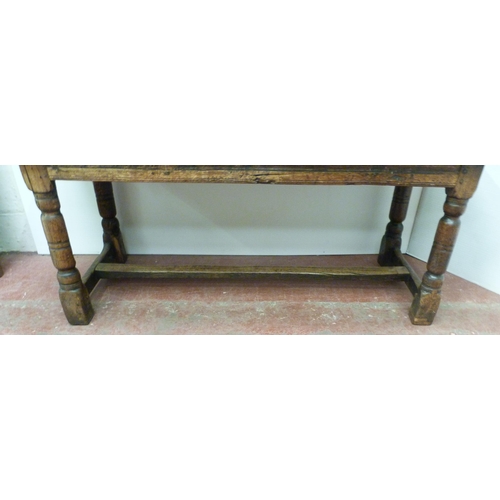 504 - Jacobean Revival jointed oak refectory table with fixed plank top above reeded frieze, on turned col... 