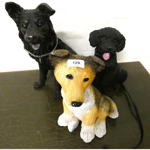 129 - Three large resin dog figures.