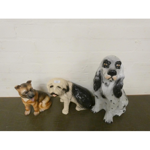 137 - Three large dog figures to include Spaniel, Dulux style dog etc.