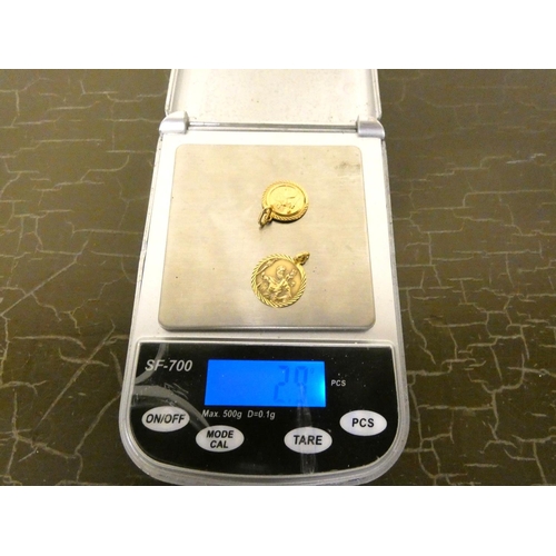 152 - Two 9ct. gold St. Christopher 2.9g.