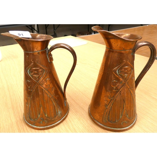 91 - Two early 20th century Joseph Sankey & Sons Art Noveau copper pitchers with tulip pattern to the... 