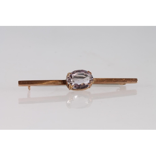 362 - 9ct gold bar brooch set with oval pink stone, 3.4g.