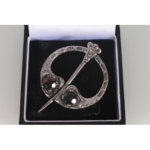 381 - Scottish silver penannular clasp brooch set with two Citrines, by Robert Allison.