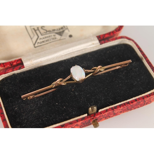 382 - 9ct gold bar brooch set with cabochon opal, 2.2g.