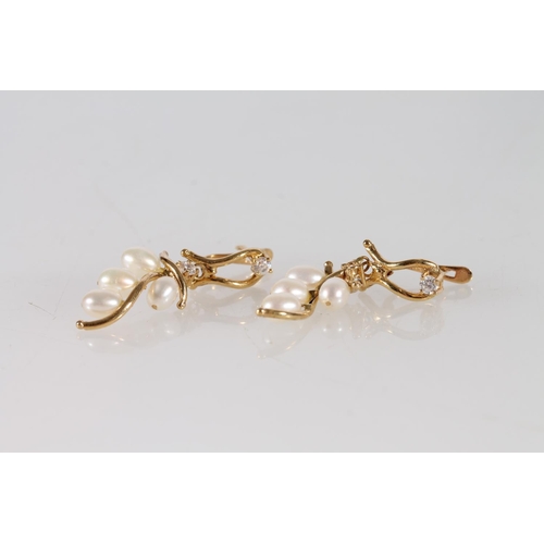 407 - Pair of 18ct gold pearl and white stone earrings, 3.4g gross,