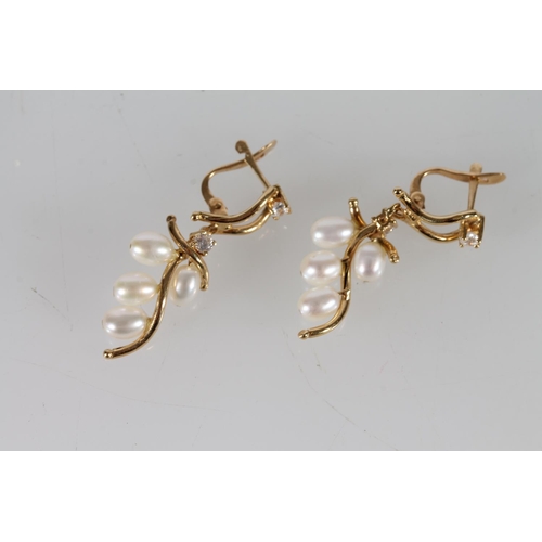 407 - Pair of 18ct gold pearl and white stone earrings, 3.4g gross,