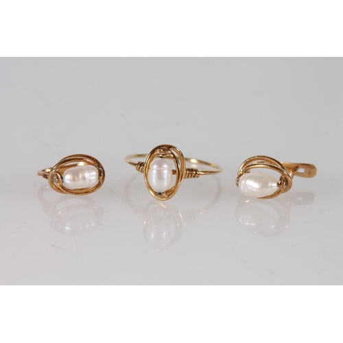 408 - Yellow metal pearl set ring and a pair of matching earrings, marks rubbed, 3.4g.