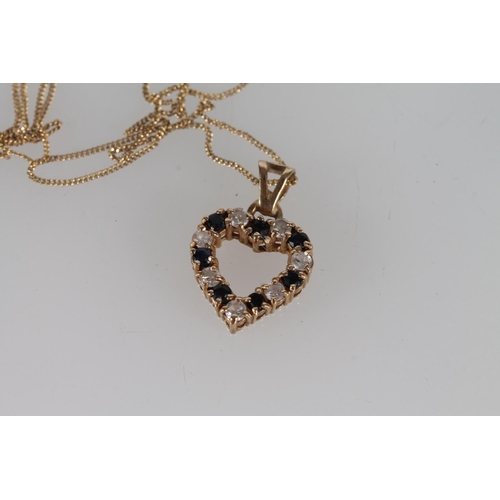 409 - 9ct gold heart pendant set with diamonds and sapphires on a 9ct gold trace chain, 2.7g gross.