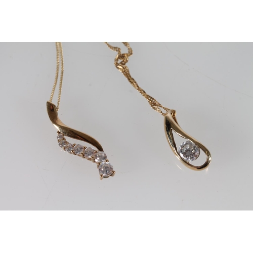 411 - Two 9ct gold mounted CZ pendants on 9ct gold chains, 3.9g gross.