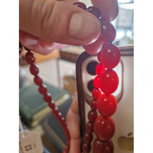 53 - Graduated string of cherry amber / resin bead necklace, approx. 53g