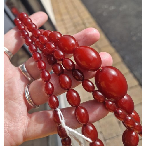 53 - Graduated string of cherry amber / resin bead necklace, approx. 53g