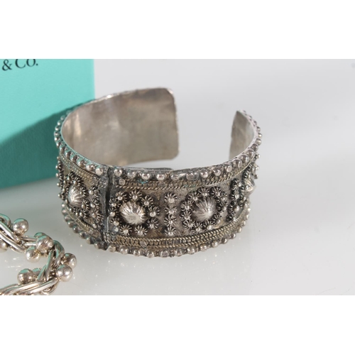 418 - German white metal cuff bangle c1890, and a silver bracelet with ball links in the manner of Links o... 