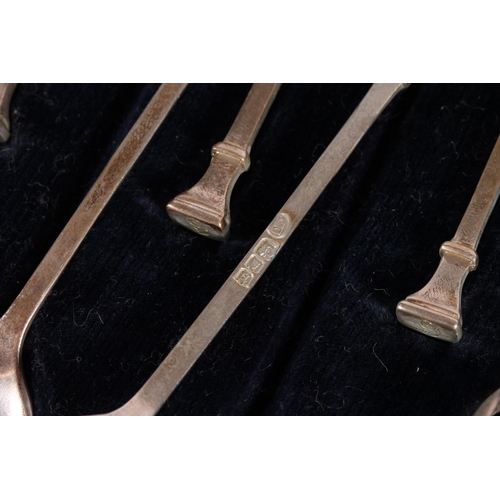 428 - Set of twelve teaspoons with seal end terminals and a pair of matching sugar tongs by Josiah William... 