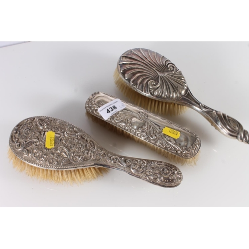 438 - Three hallmarked silver dressing table brushes