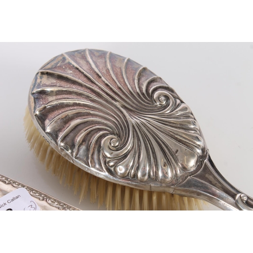 438 - Three hallmarked silver dressing table brushes