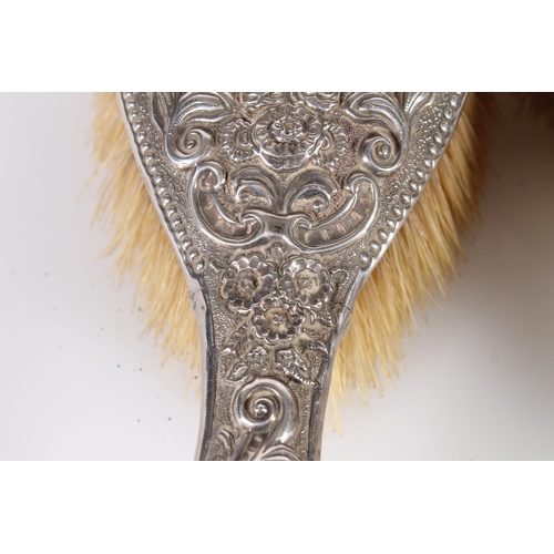 438 - Three hallmarked silver dressing table brushes