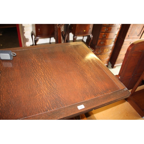 491 - Oak draw leaf dining table, 76cm high.