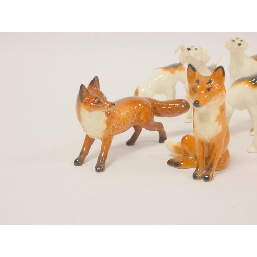 187 - Group of Beswick figures comprising of eight foxhounds and two foxes. (10)