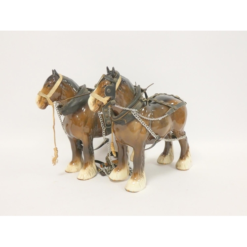 189 - Two Beswick chestnut Shire horses, with harnesses. Height 21cm. (2)