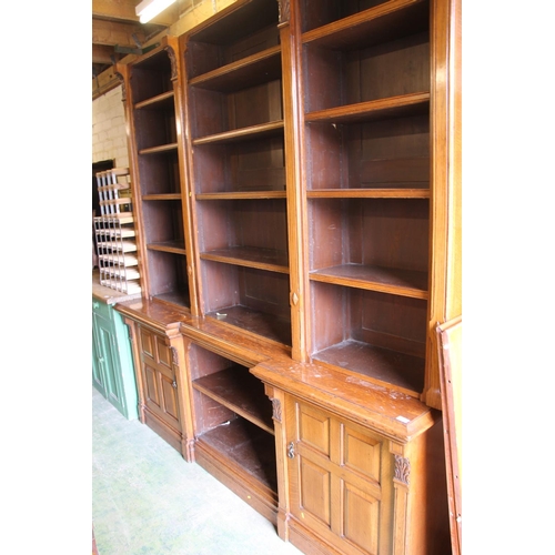 450 - Victorian oak break front bookcase with two cabinets to lower section, 241cm tall x 226cm wide.