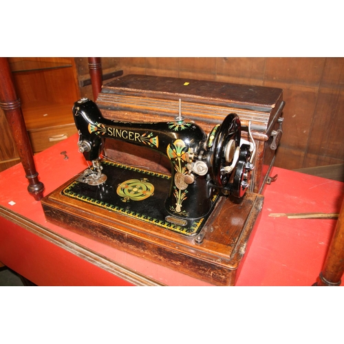 465 - Cased Singer sewing machine.