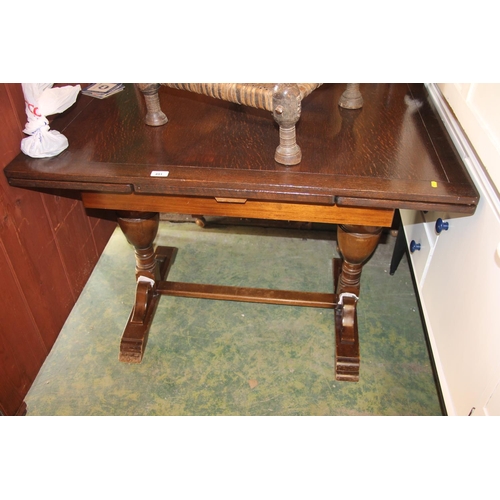 491 - Oak draw leaf dining table, 76cm high.