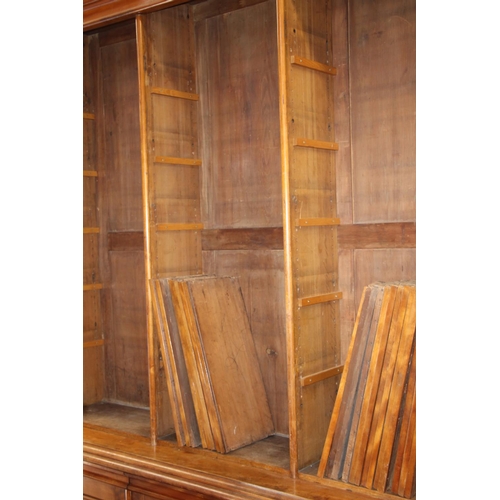 520 - Pair of substantial Victorian library bookcases over cupboards. 262cm height x 212cm width.